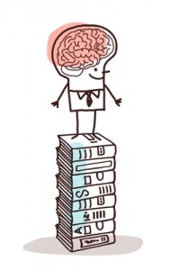 Image of Man w Big Brain on Stack of Books